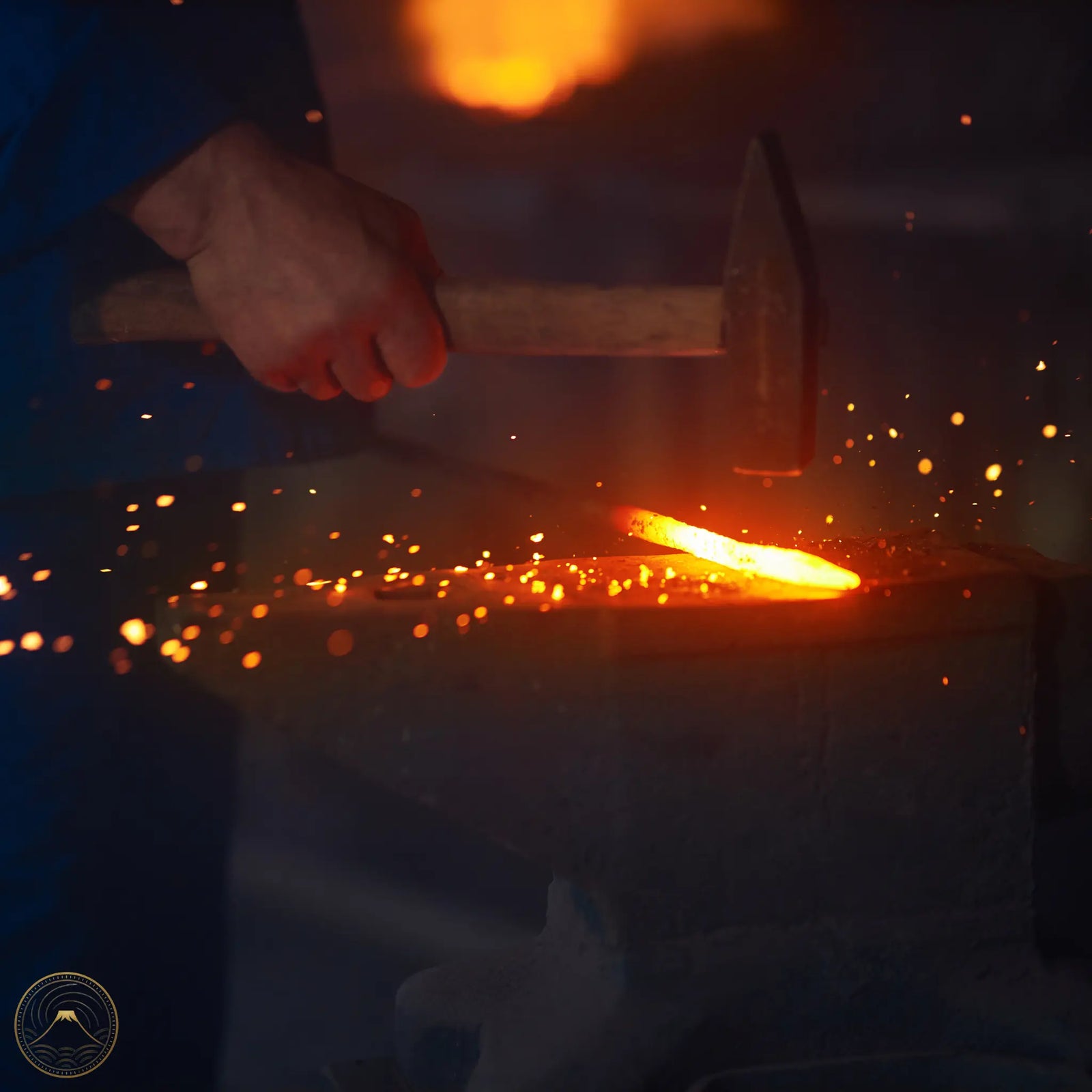 Blacksmith Hammering red hot steel on anvil