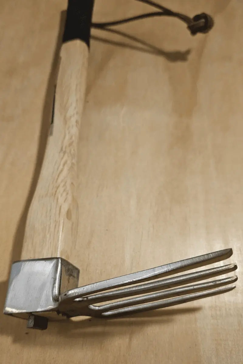 One-handed forged stainless steel garden fork - East-West Tools