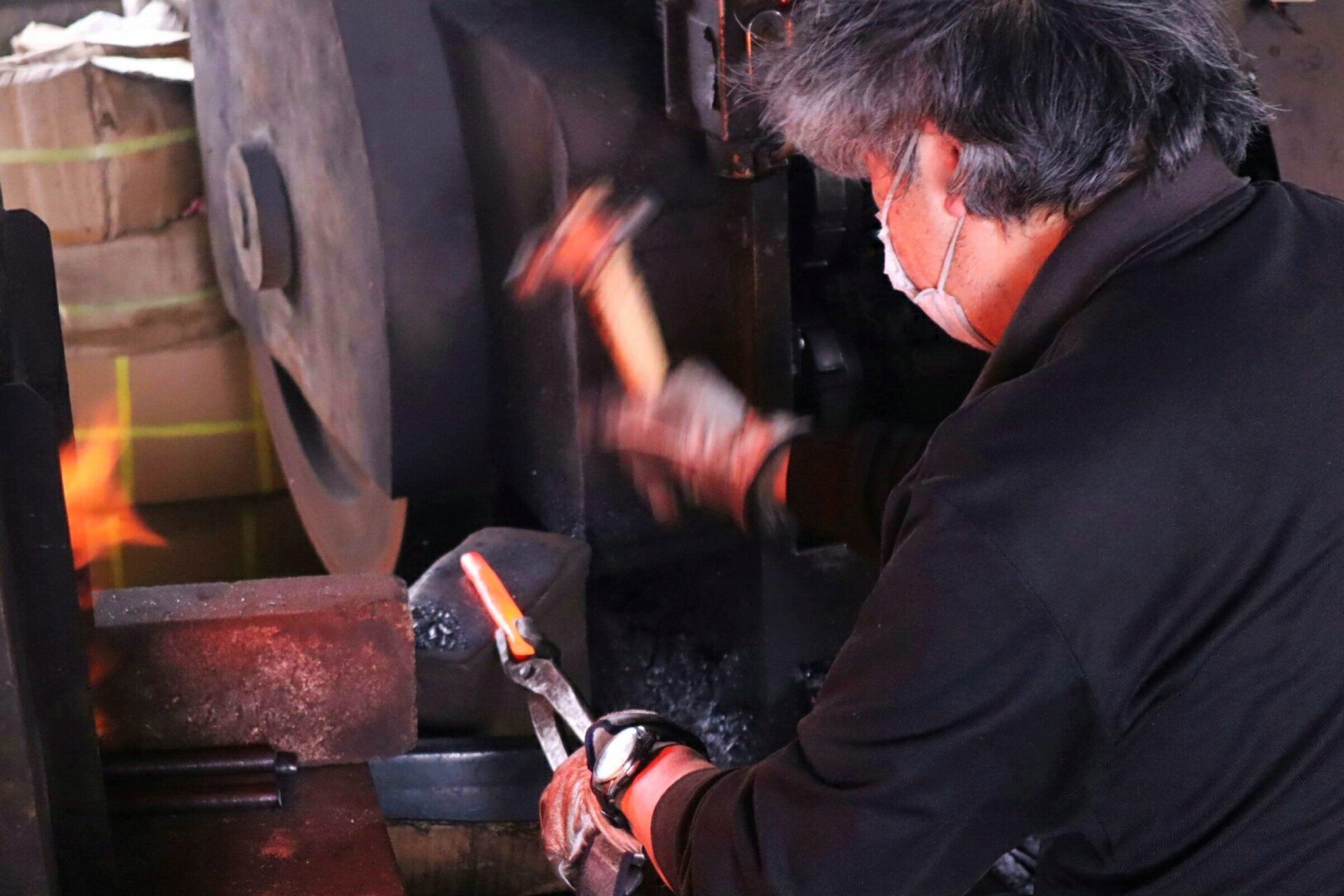 Tobisho blacksmith hammering red hot billet