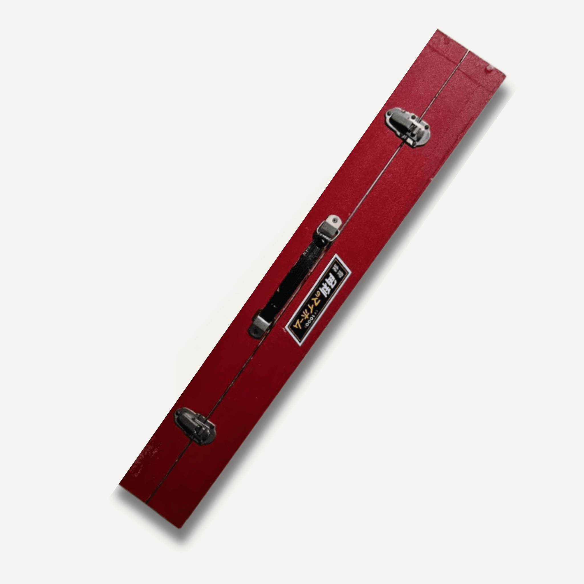 Red tool box with black handles on a white background