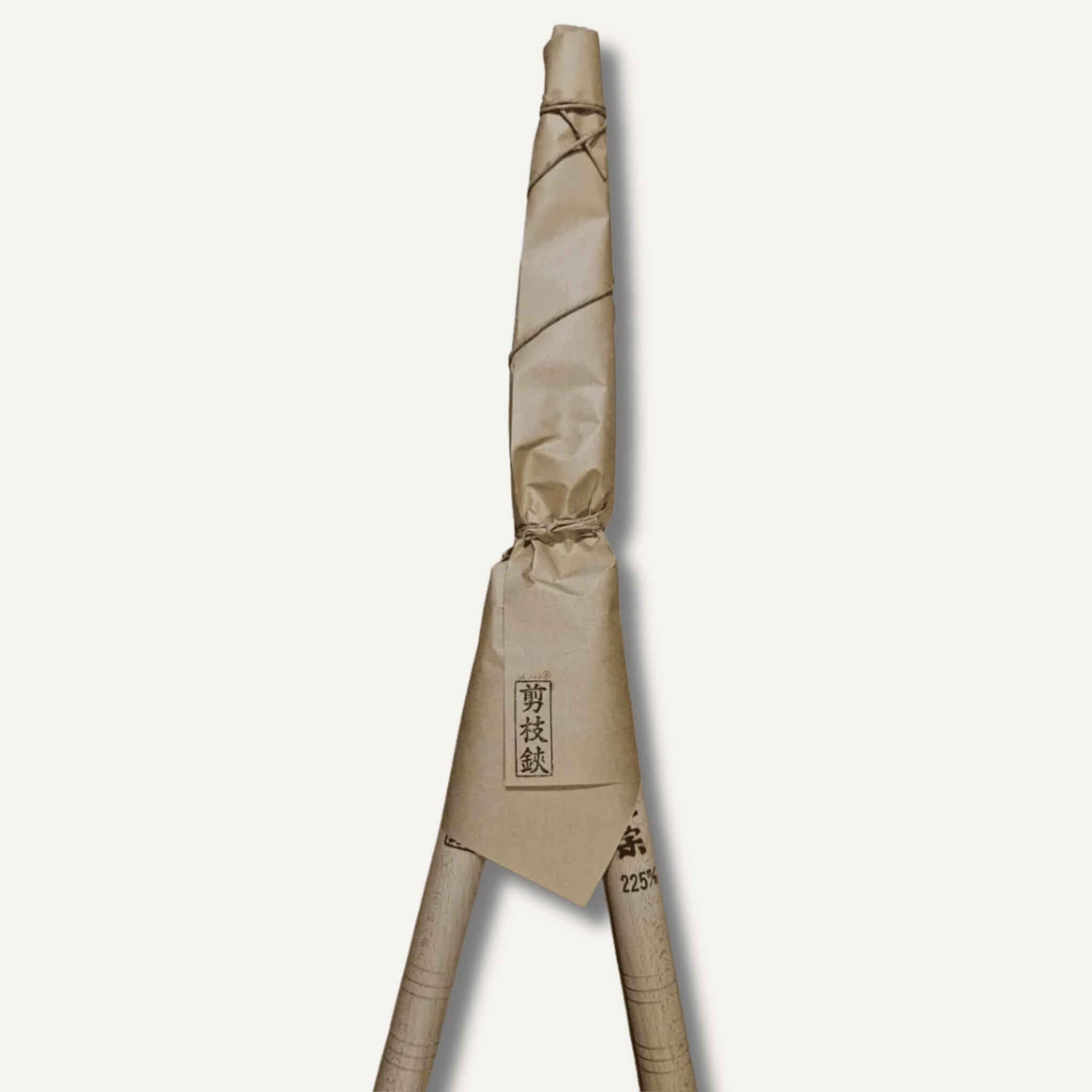 Pair of gardening shears with a beige cover on a white background
