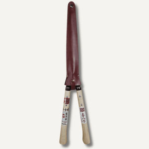 Gardening shears with a leather handle on a white background