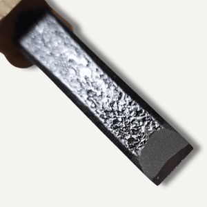 Close-up of a textured metal bar with a wooden handle on a white background