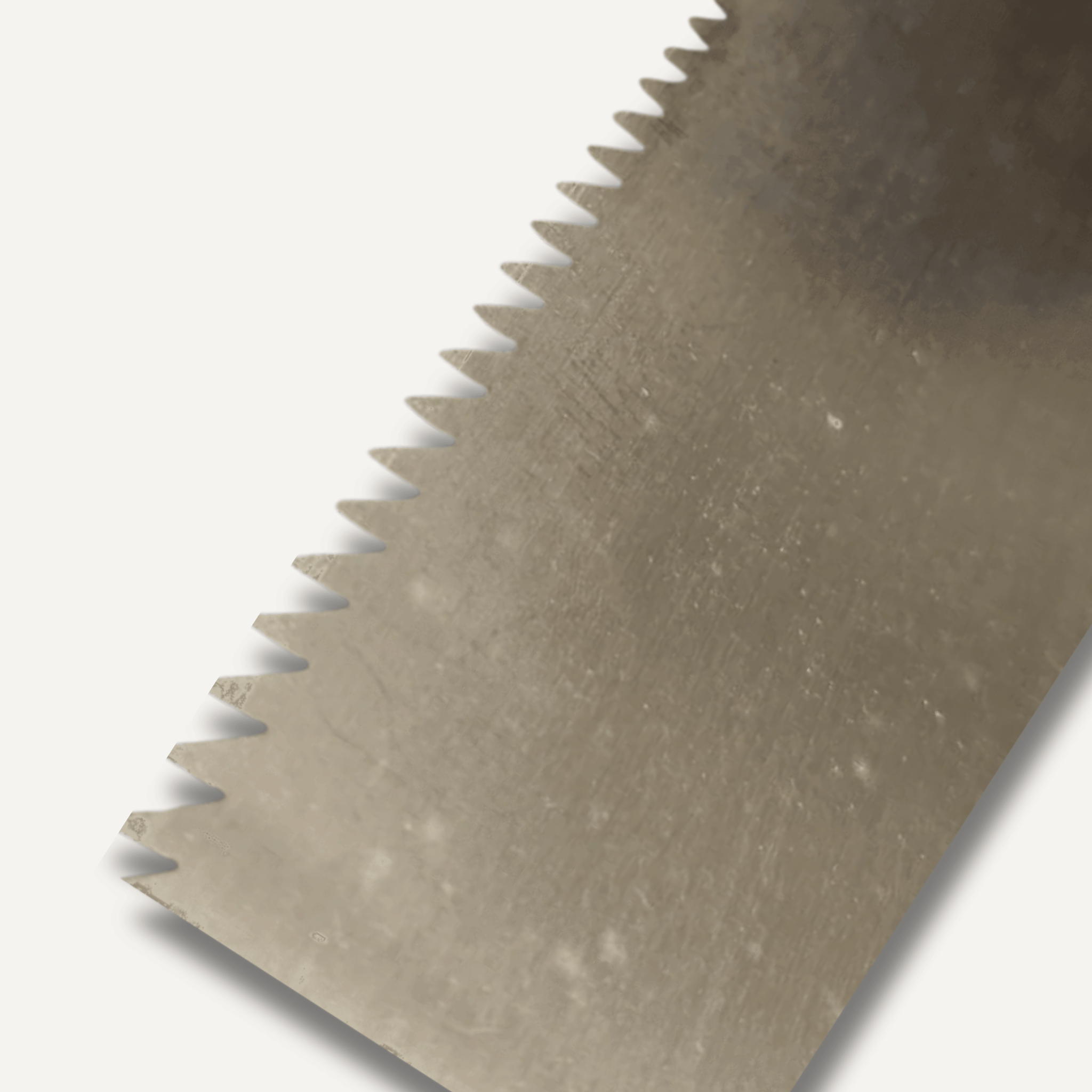 Close-up of a metal blade with teeth on a white background