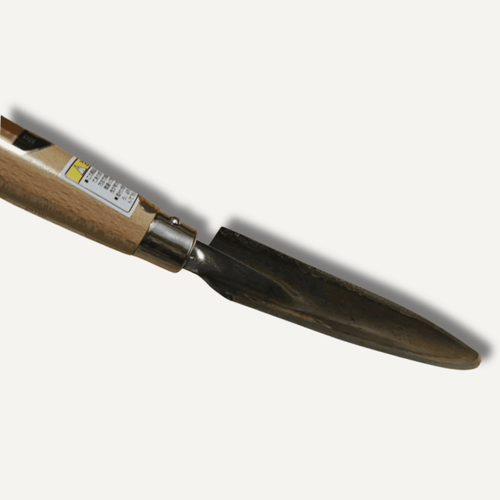 Close-up of Bonsai forged garden trowel showing carbon steel blade and wooden handle