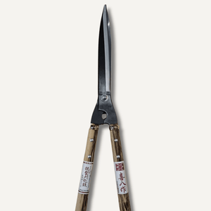 Pair of gardening shears with wooden handles on a white background
