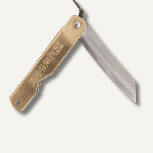 Higonokami Aogami pocket knife open, showing blue paper steel blade and folded metal handle