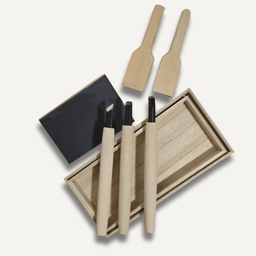 Cypress spoon carving knife set showing gouges and carving blades with wooden handles