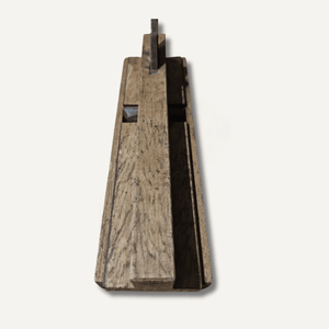 Wooden tool with a textured surface on a white background