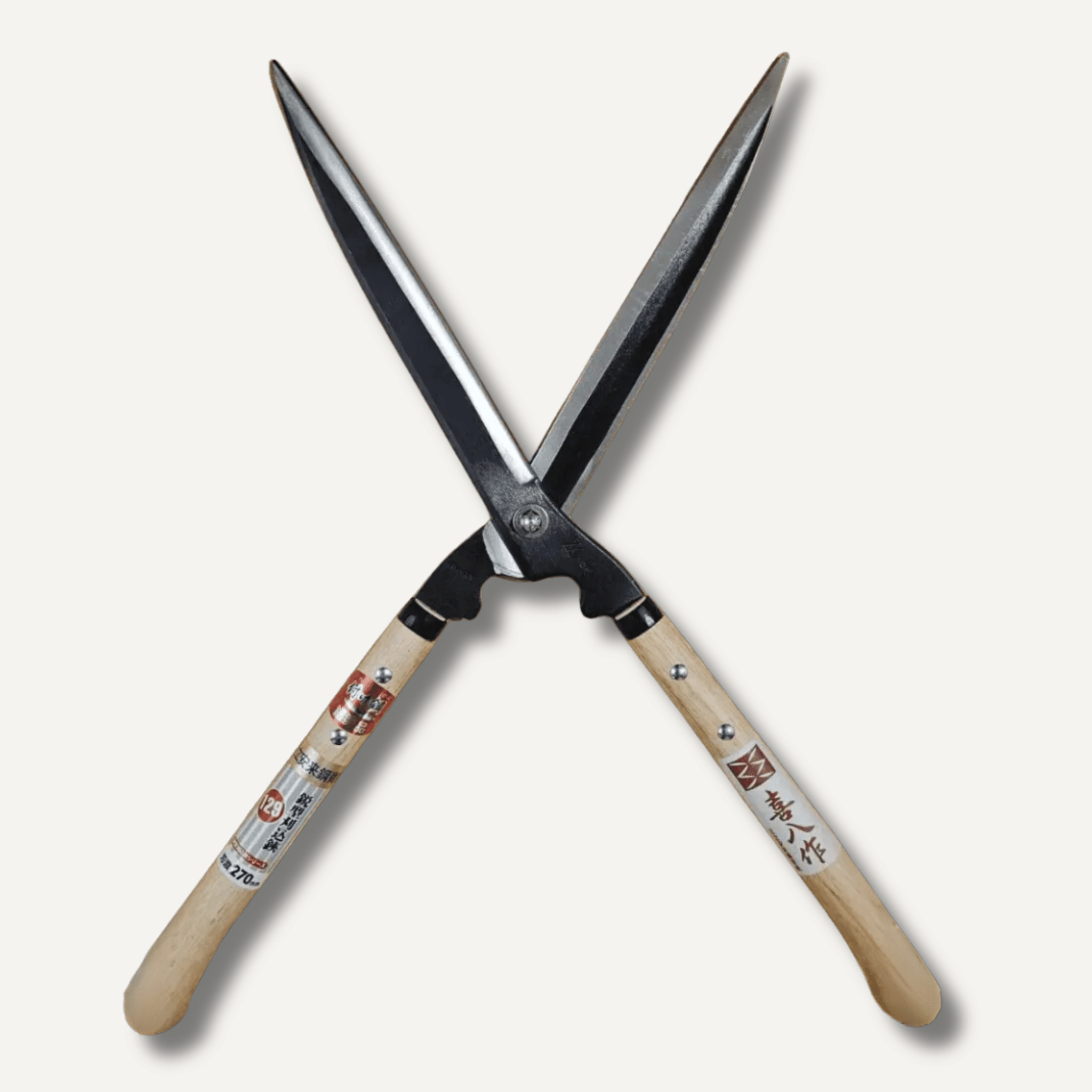 Pair of garden shears with wooden handles on a white background