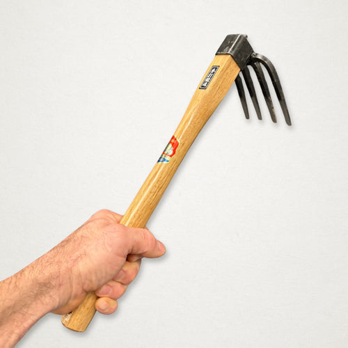 Azui No.101 Japanese four-tine hand hoe in hand for close weeding and soil cultivation