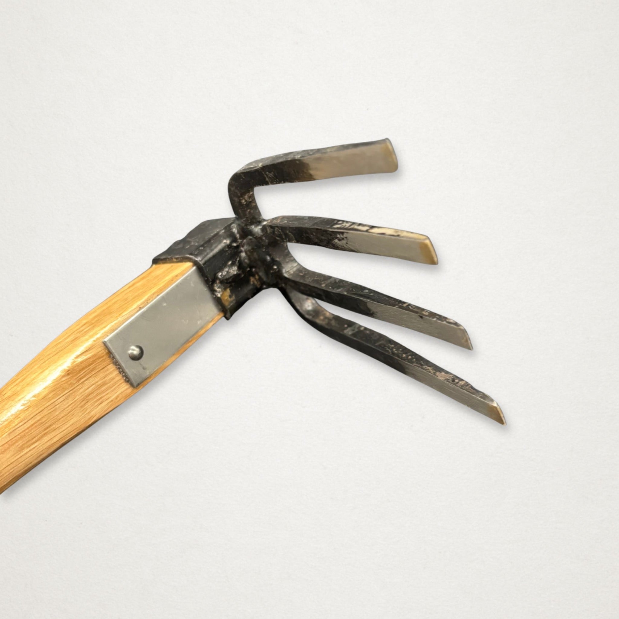 Close-up of Azui No.101 forged four-tine hand hoe head for weeding