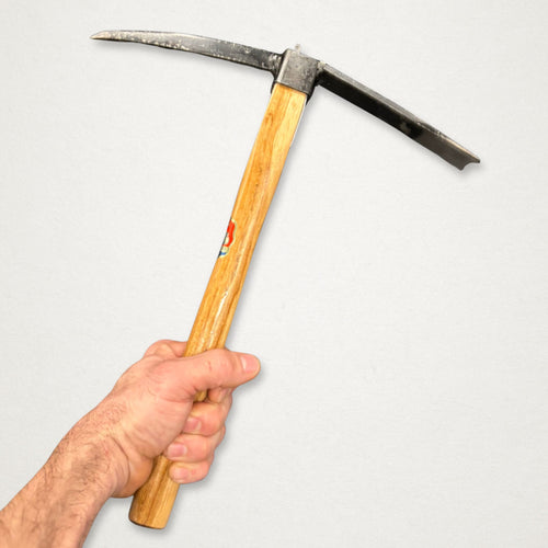 Hand holding Azui No.106 Japanese garden mattock with 390mm beech handle for soil cultivation