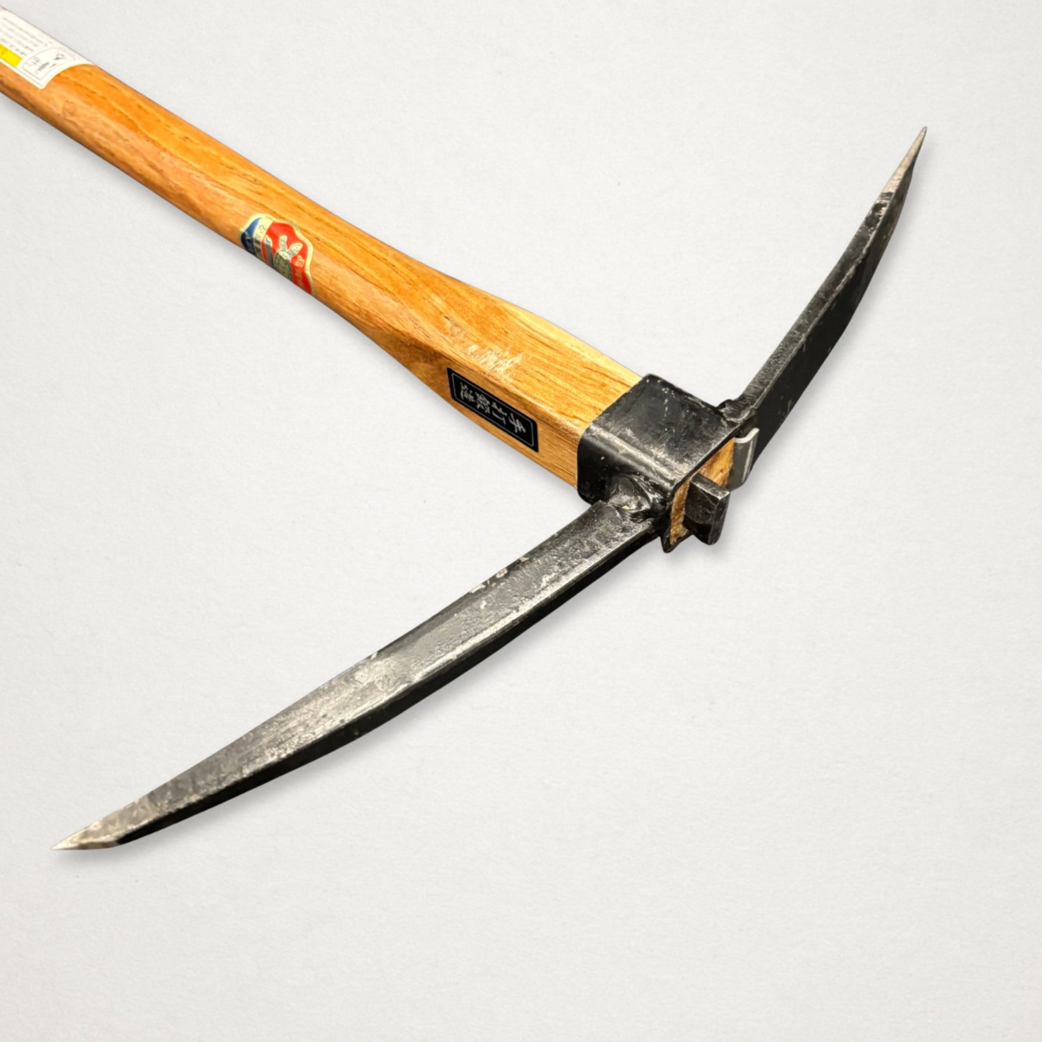 Side profile of Azui No.106 Japanese garden mattock with 390mm beech handle on wooden board