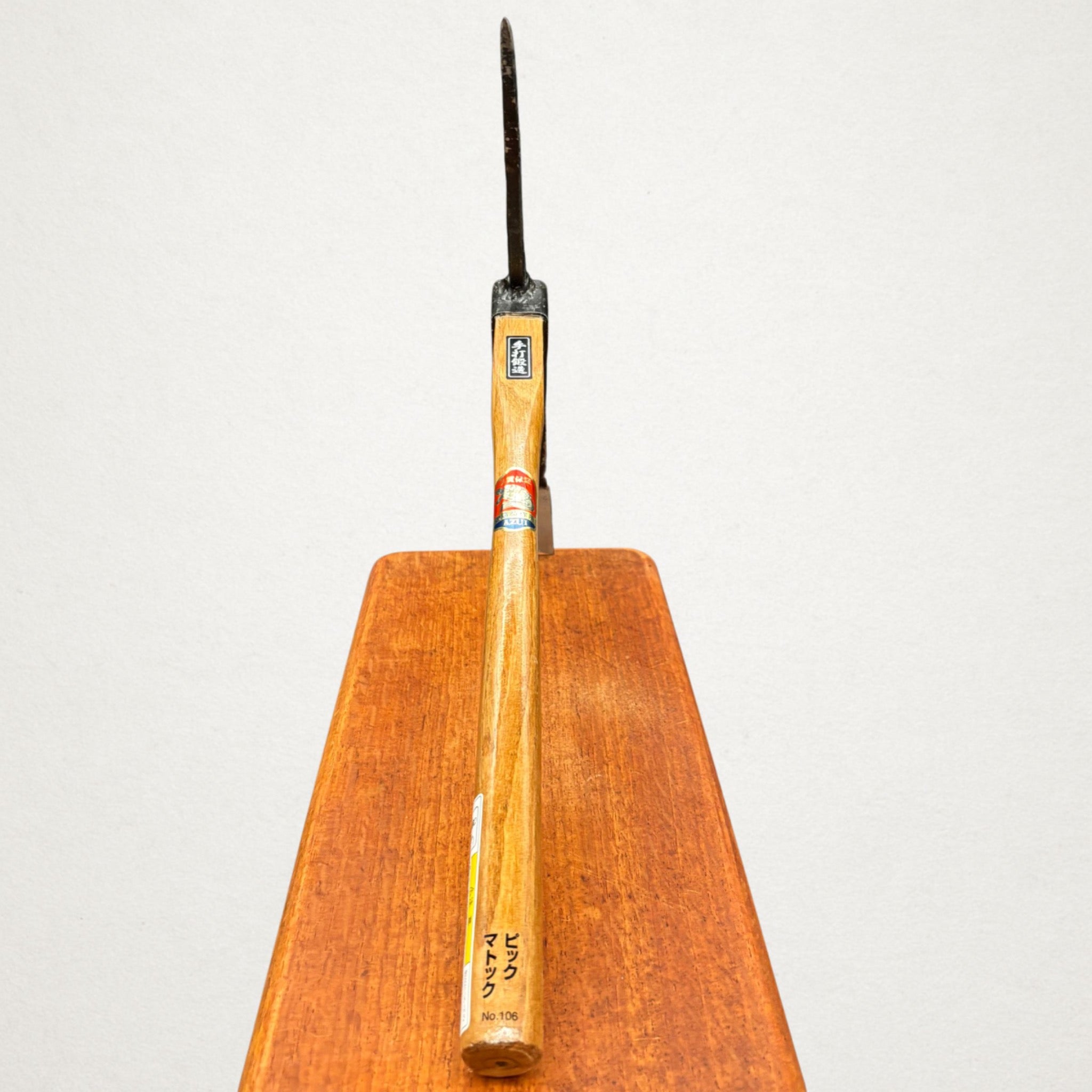 Front edge view of Azui No.106 Japanese pick mattock showing narrow blade and pointed soil-working head