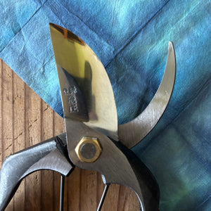 Close-up of Tobisho Classic Type-A 200 mm pruning shear blades, highlighting polished edge finish