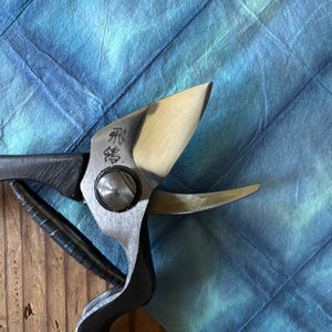 Close-up of Tobisho Hirei pruning shears joint and blades, highlighting forged steel and finish