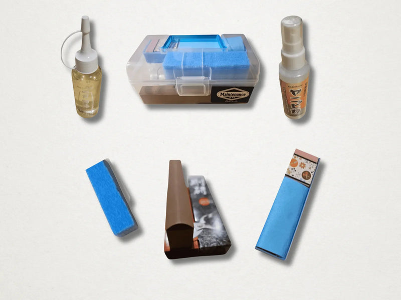 Collection of garden maintenance products including bottles, a box, and sponges on a light gray background