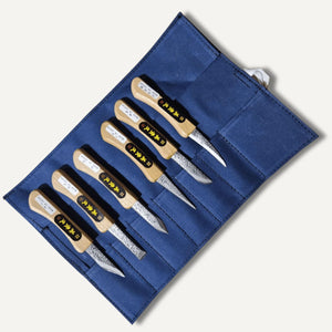 Ikeuchi Hamono 6 piece carving knife set on blue canvas wrap blades showing