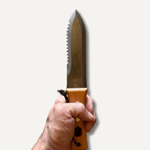 Stainless steel bonsai hori hori knife held in hand