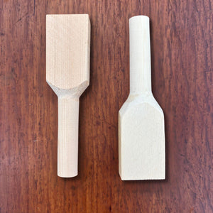 Close view of hinoki teaspoon blank pair showing rough spoon head shape and handle