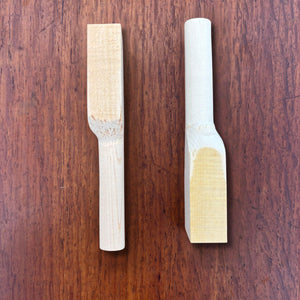 Rear side view of Japanese hinoki teaspoon blanks on a timber surface
