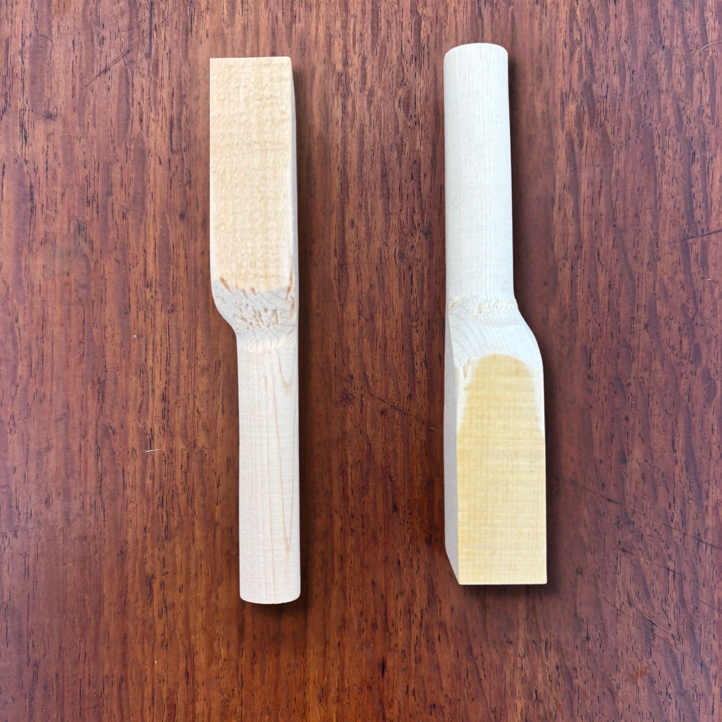 Rear side view of Japanese hinoki teaspoon blanks on a timber surface