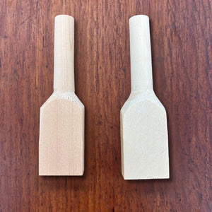 Front and back view of hinoki teaspoon carving blanks on a timber surface