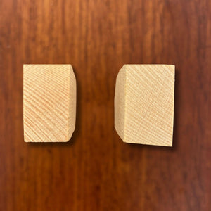Top end view of hinoki spoon blanks showing carved block shape