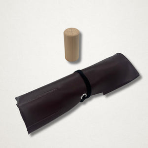 Rolled dark brown tool case included with the Michi Hamono Little Jizo carving kit