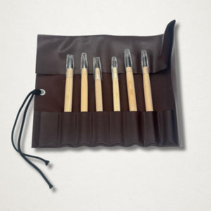 Michi Hamono Little Jizo carving kit tools displayed in an open dark brown tool roll on a light background