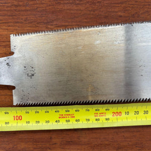 Tape measure beside vintage Japanese ryoba saw blade showing approximate 210mm cutting edge length