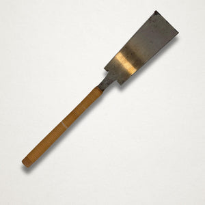 Vintage Japanese 210mm ryoba pull saw with rattan-wrapped handle and aged carbon steel blade, shown front-on against a white background