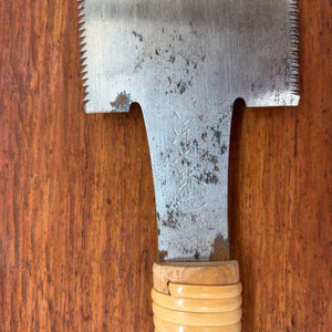  Close-up of tang area on vintage Japanese ryoba saw showing faint blade stamp above the wooden handle