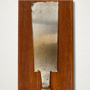 Back view of vintage Japanese 210mm ryoba saw showing traditional wrapped handle and blade profile