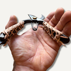 secateurs with leather grips held in hand