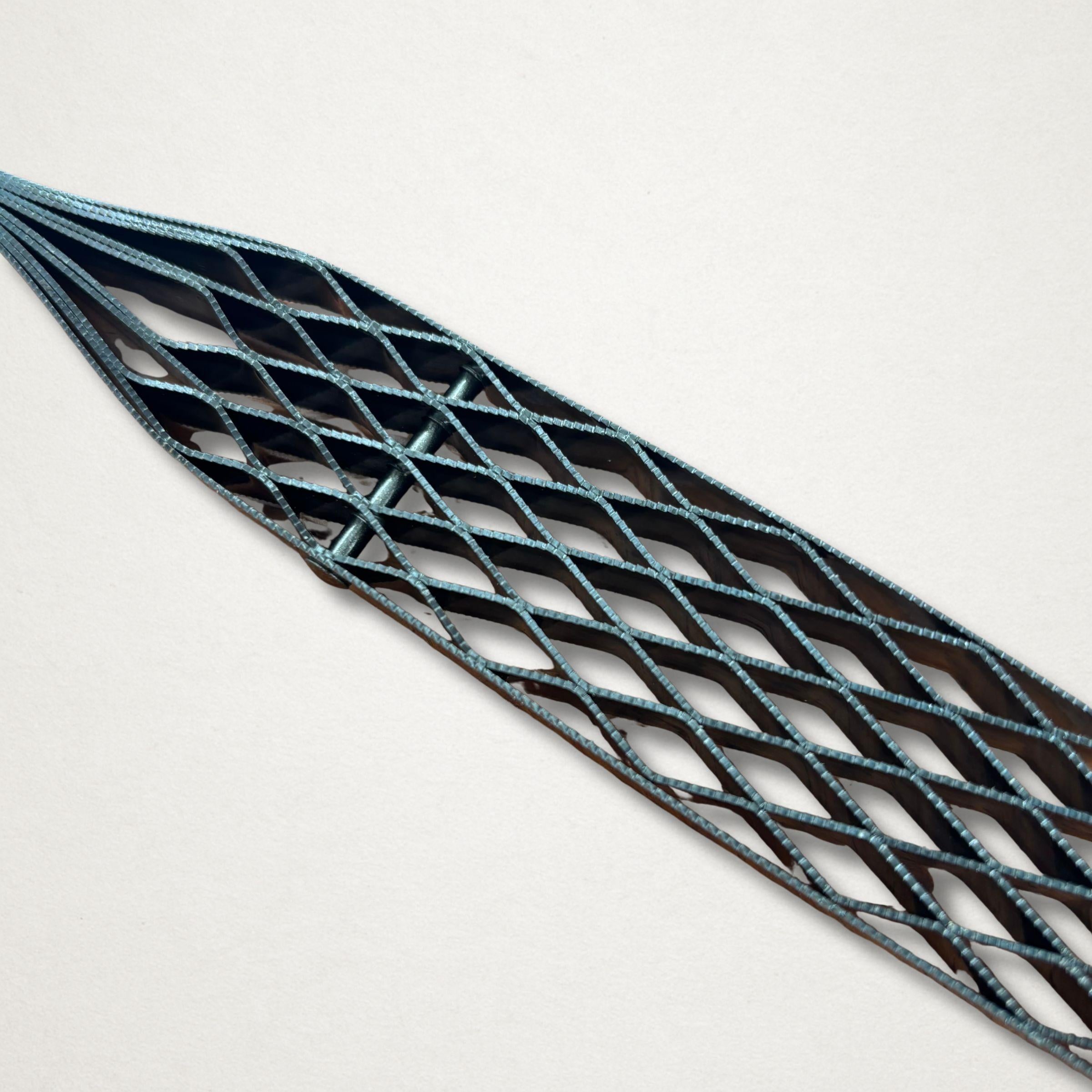 Close-up of the open diamond tooth pattern on the Shinto saw rasp blade