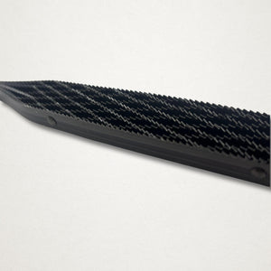 Angled close-up of the Shinto saw rasp blade showing the double-sided cutting pattern