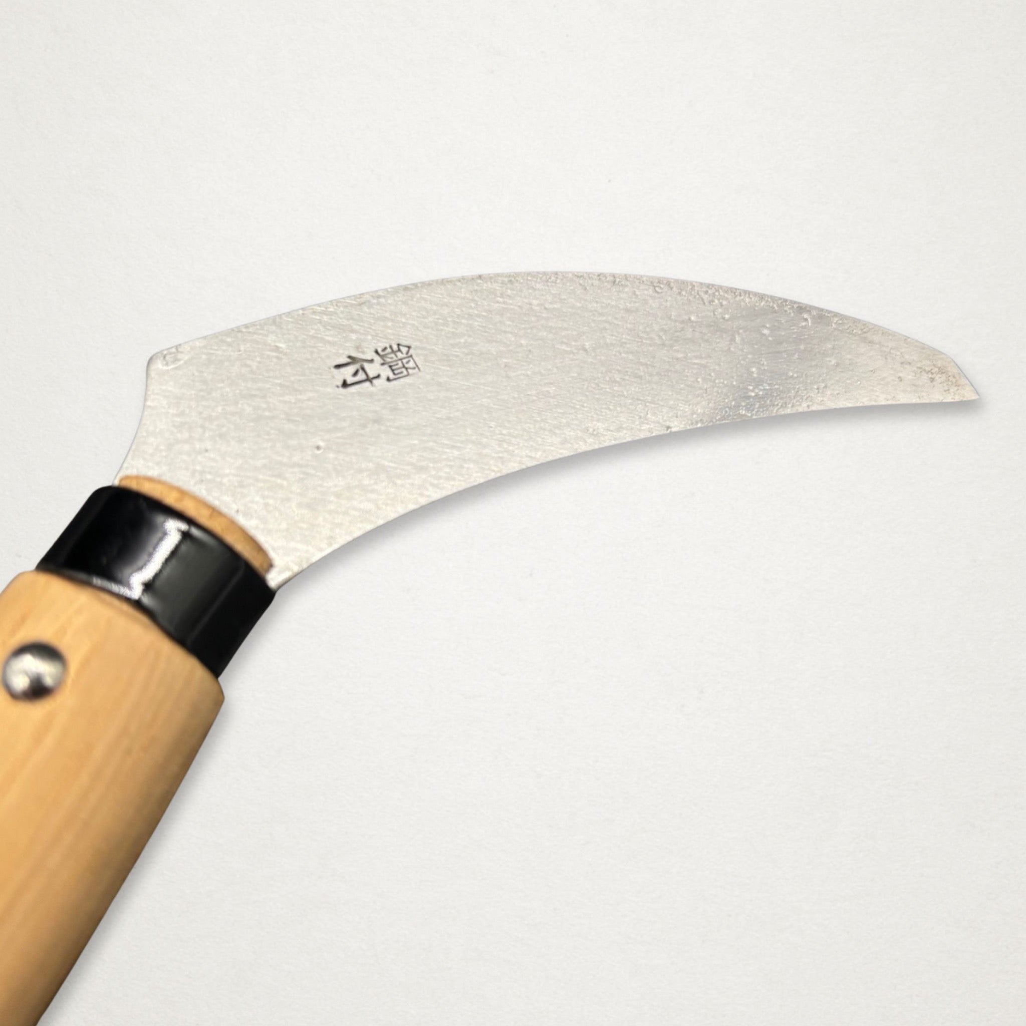 Close-up of Takemoto Banshu Piccolo Sickle 90mm blade engraving and carbon steel cutting edge