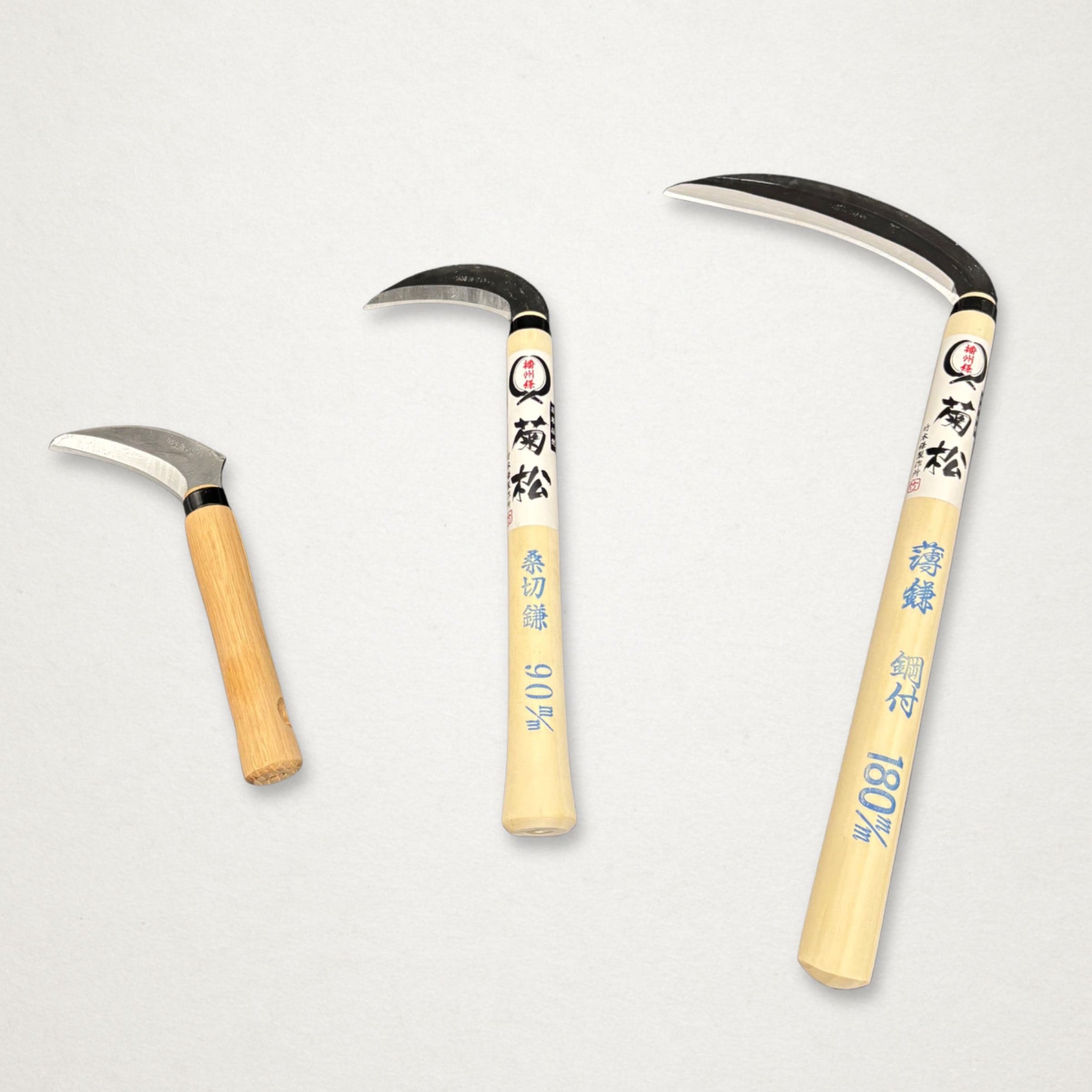 Takemoto Kikumatsu mulberry sickle 90mm shown beside larger Takemoto sickles for size comparison