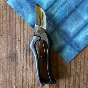 Tobisho Classic Type-A 200 mm pruning shears upright on indigo-dyed washi paper background