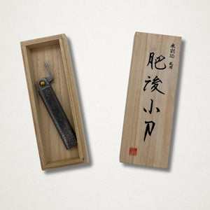 Japanese higo knife presented in a wooden storage box beside the lid with black Japanese calligraphy