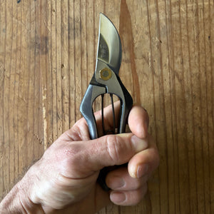 Hand holding Tobisho Classic Type-A 185 mm pruning shears, compact variant with shorter handles and blades