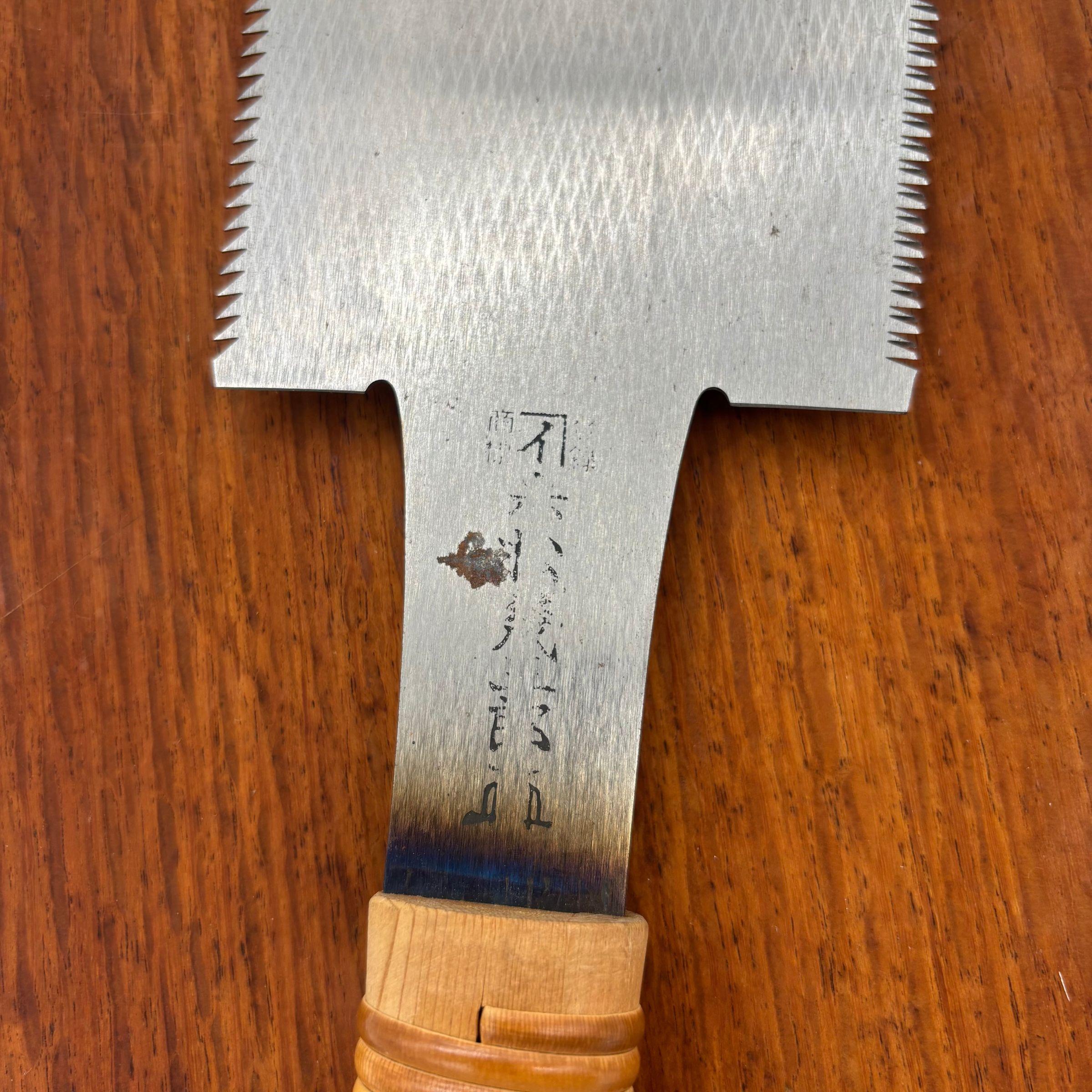 Close-up of tang stamp, visible patina spot and heat temper colouring above the handle