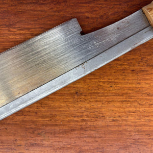 Vintage Japanese 240mm dozuki saw blade close-up showing forge-welded tang line and hand-finished carbon steel surface.