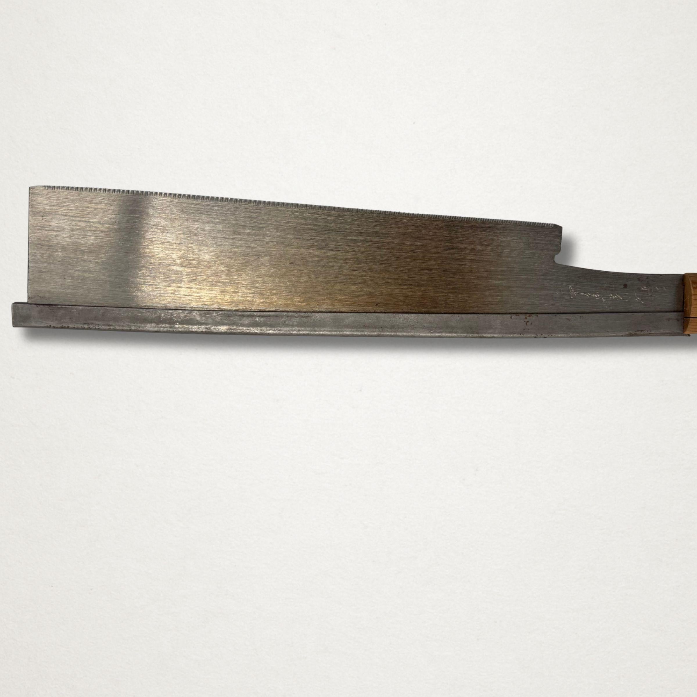 Side profile of a vintage Japanese 240mm dozuki saw showing backed spine, blade depth, and carbon steel finish.