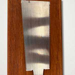 Close-up of polished blade on vintage 210mm Japanese ryoba saw showing tapered plate and double cutting edges
