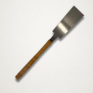Vintage 210mm Japanese ryoba saw front view showing tapered double-edged blade and rattan-wrapped handle