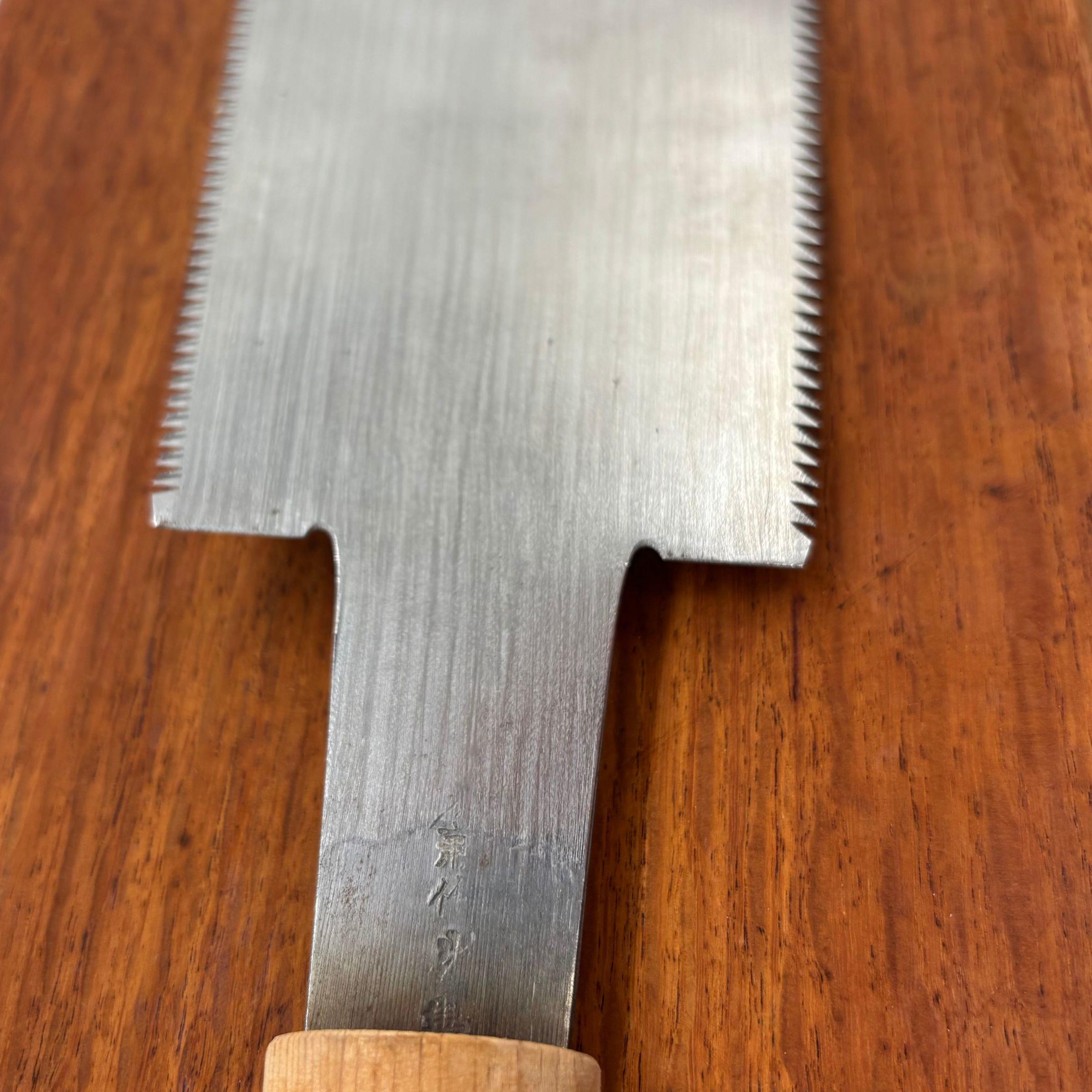 Close-up of maker stamp on tang of vintage 210mm Japanese ryoba saw