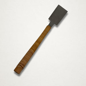 Vintage 210mm Japanese ryoba saw rear view showing spine side and rattan-wrapped handle